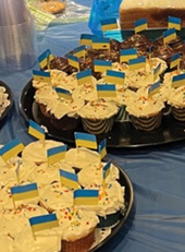 A display of cupcakes decorated with the Ukraine flag